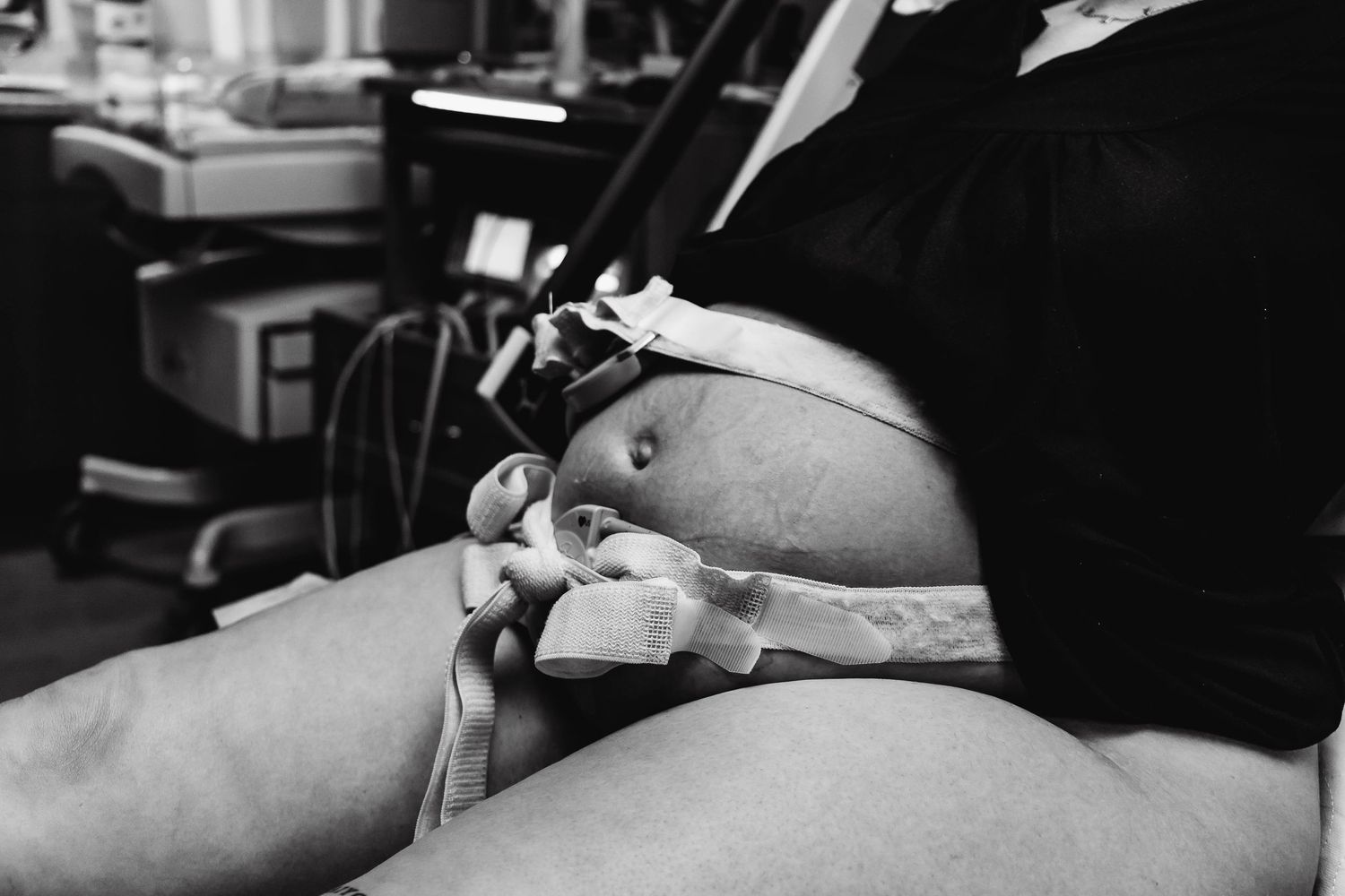 pregnant mothers belly with monitors on