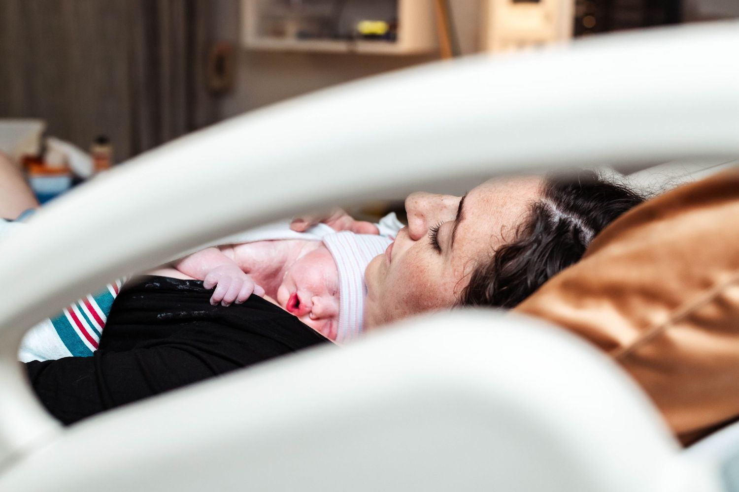 Mother holds baby in San Antonio hospital bed after delivery