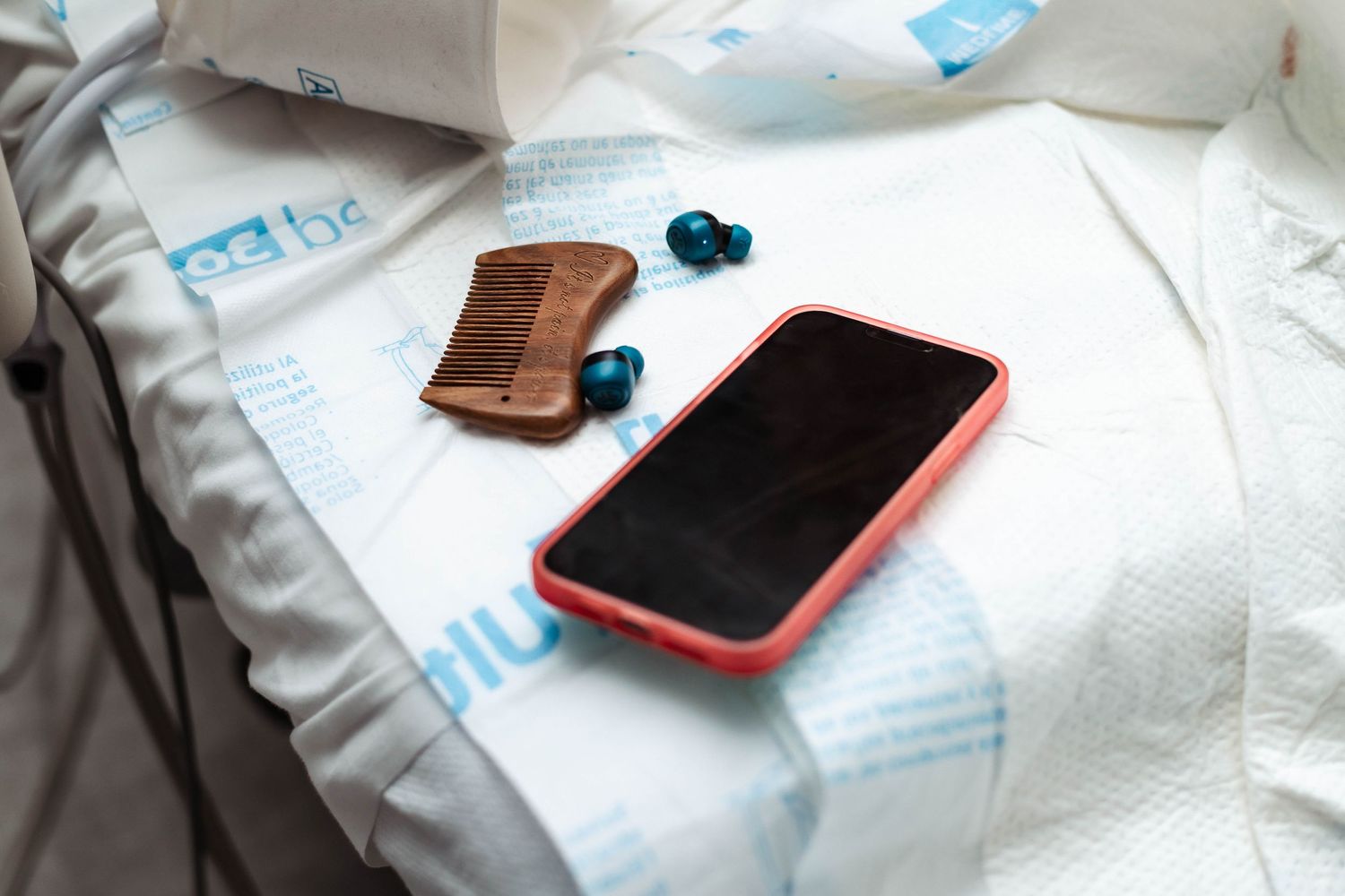 Phone and headphones sit on a table in labor room