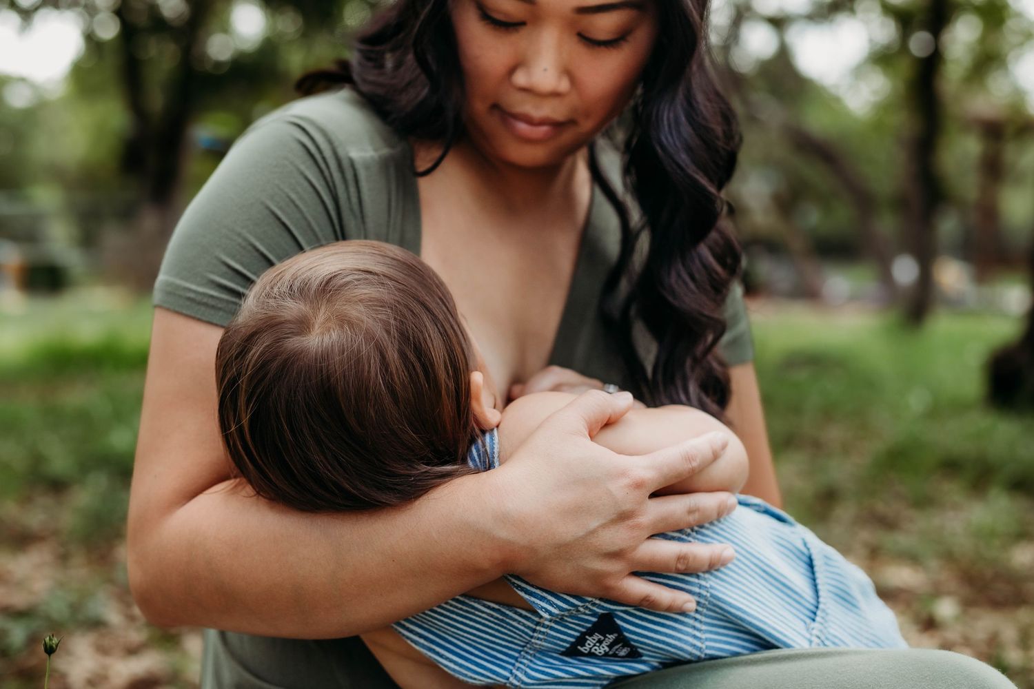 Mother nursing her toddler at annual breastfeeding sessions
