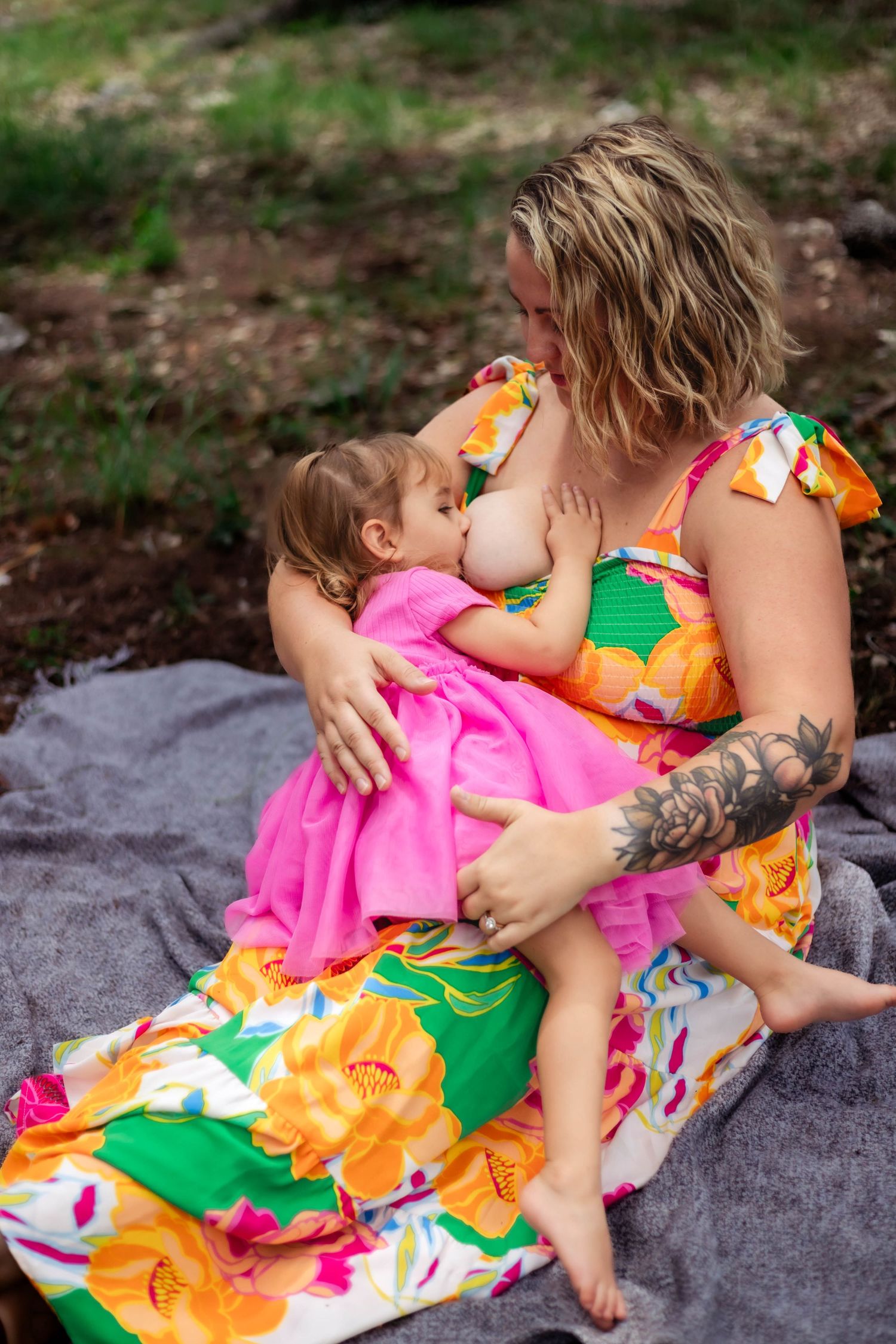 Mother nurses older child