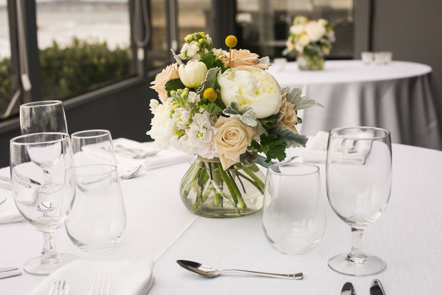 Elegant Beachfront Table Setting with Flowers in Half Moon Bay, CA.