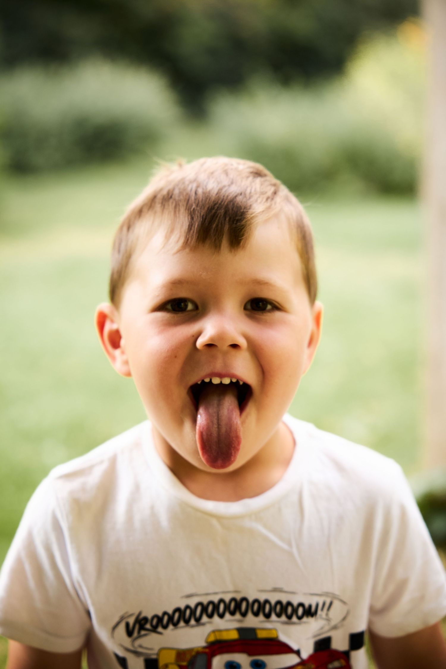 Close up sequence of playful expressions and silly faces on white t-shirt.