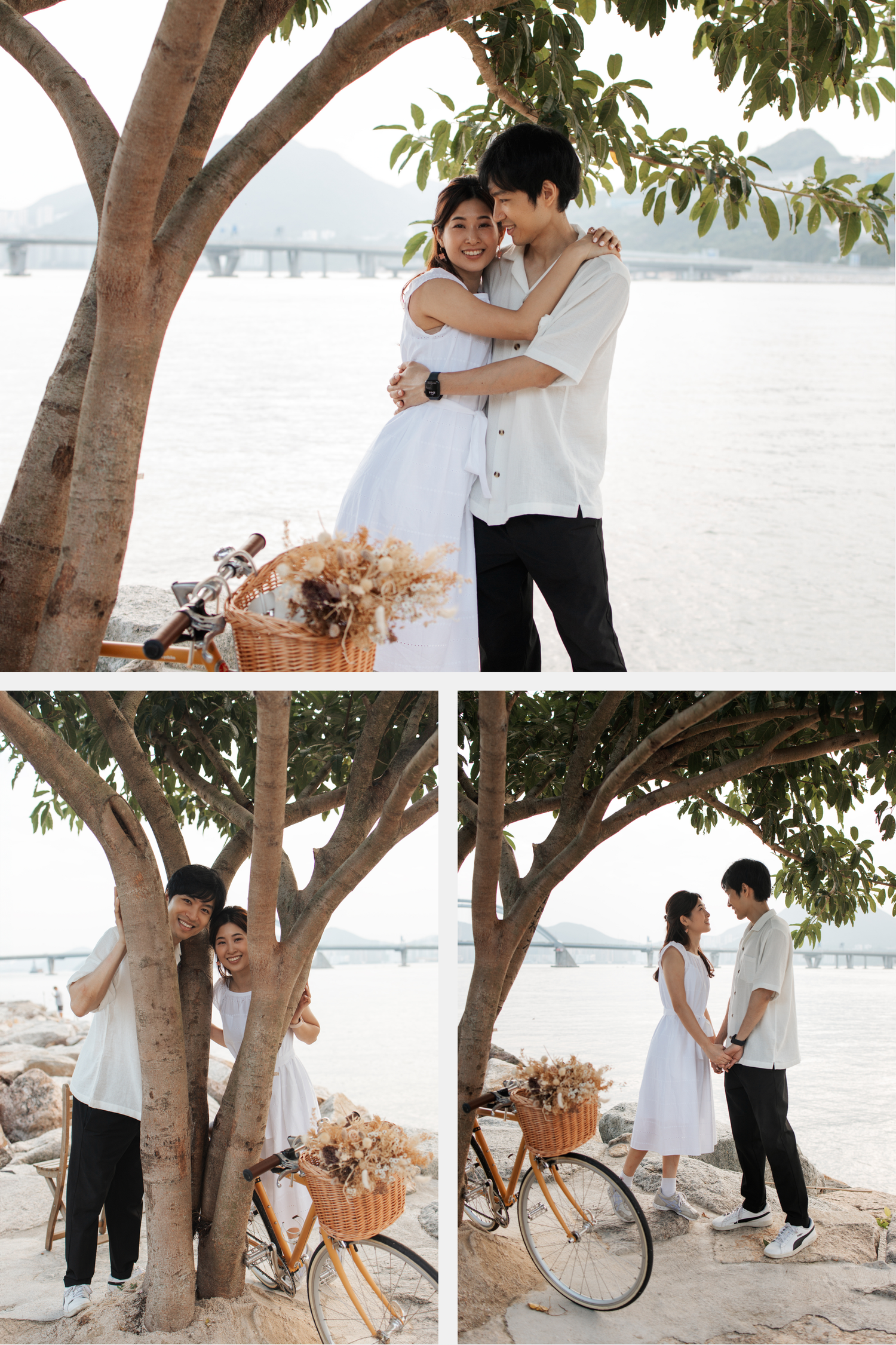 A romantic couple embraces near a tree on a beach with a vintage bicycle and dried flower bouquet creating a dreamy scene. Couple Photoshoot