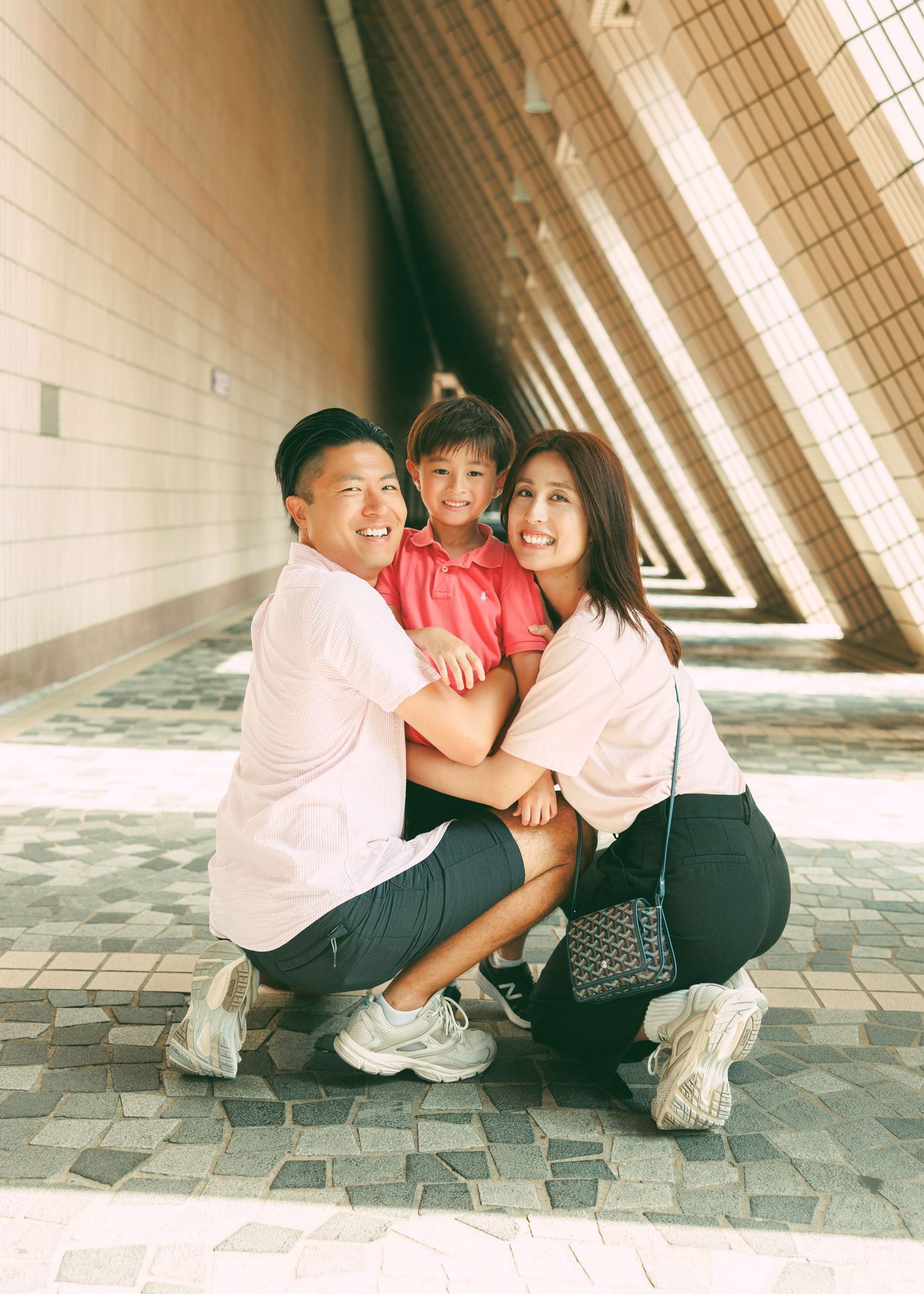 A couple sitting on tiled steps share tender moments in a repeating photo series with warm natural lighting. Family Photoshoot in Hong Kong