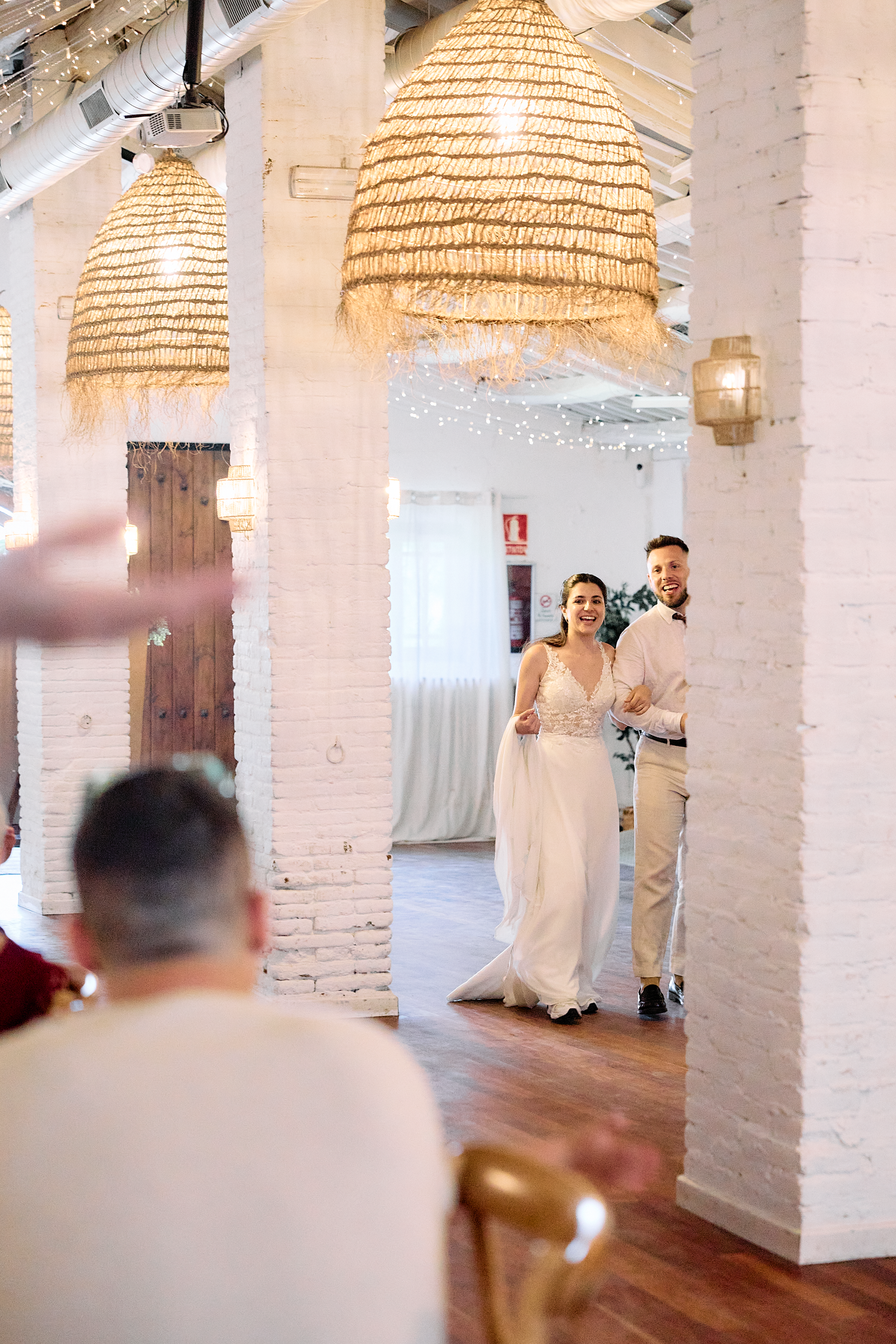 Bride and groom sharing a quiet moment during their intimate wedding reception in Barcelona.