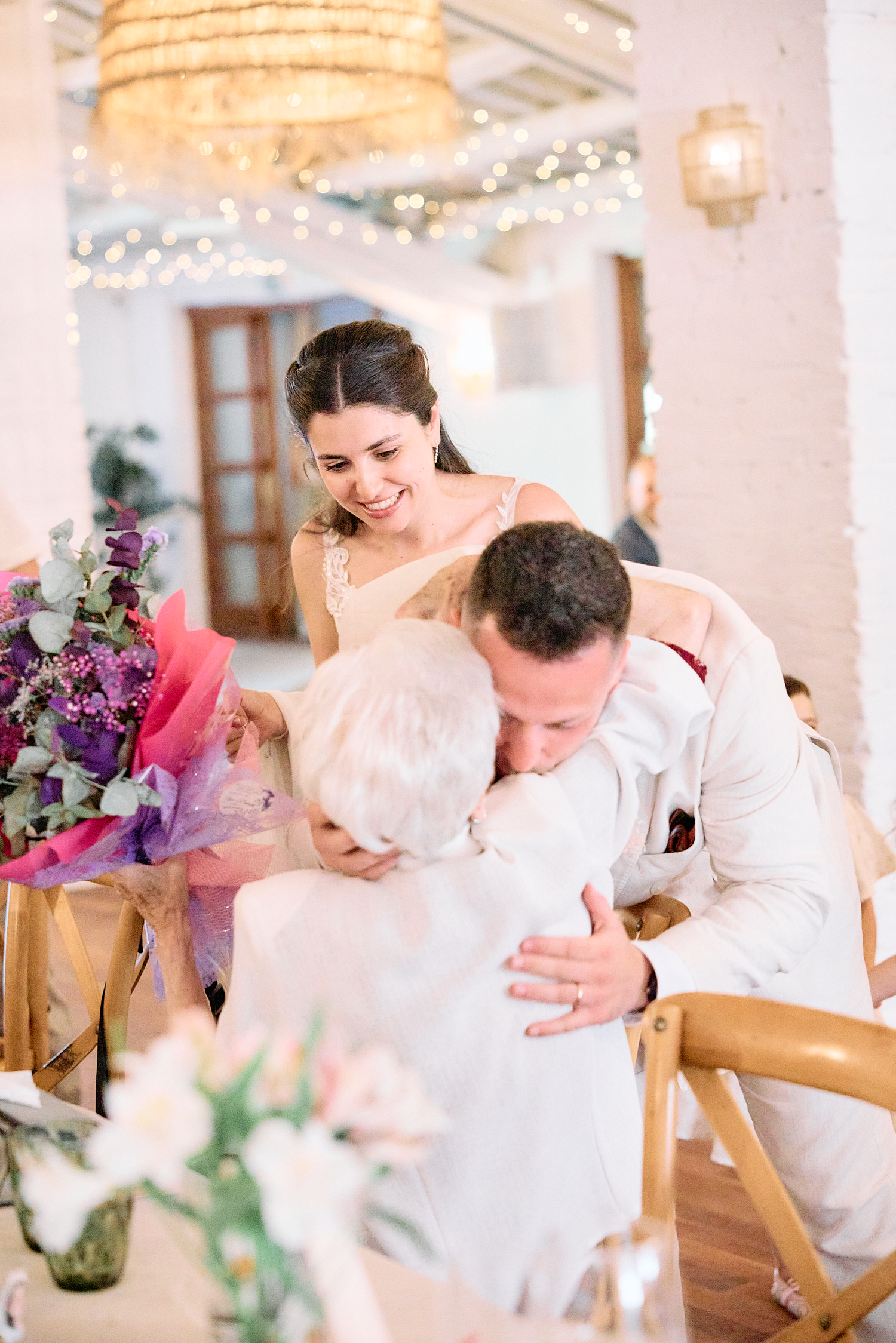 Joyful candid moment between wedding guests during an intimate reception in Barcelona.