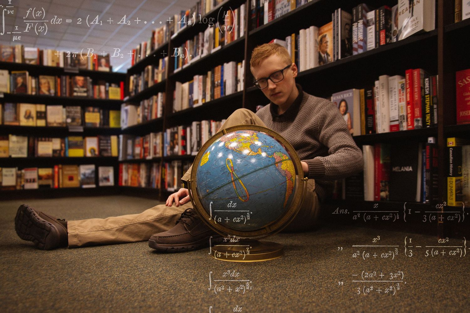 Man sitting on bookstore floor with globe surrounded by floating mathematical equations.
