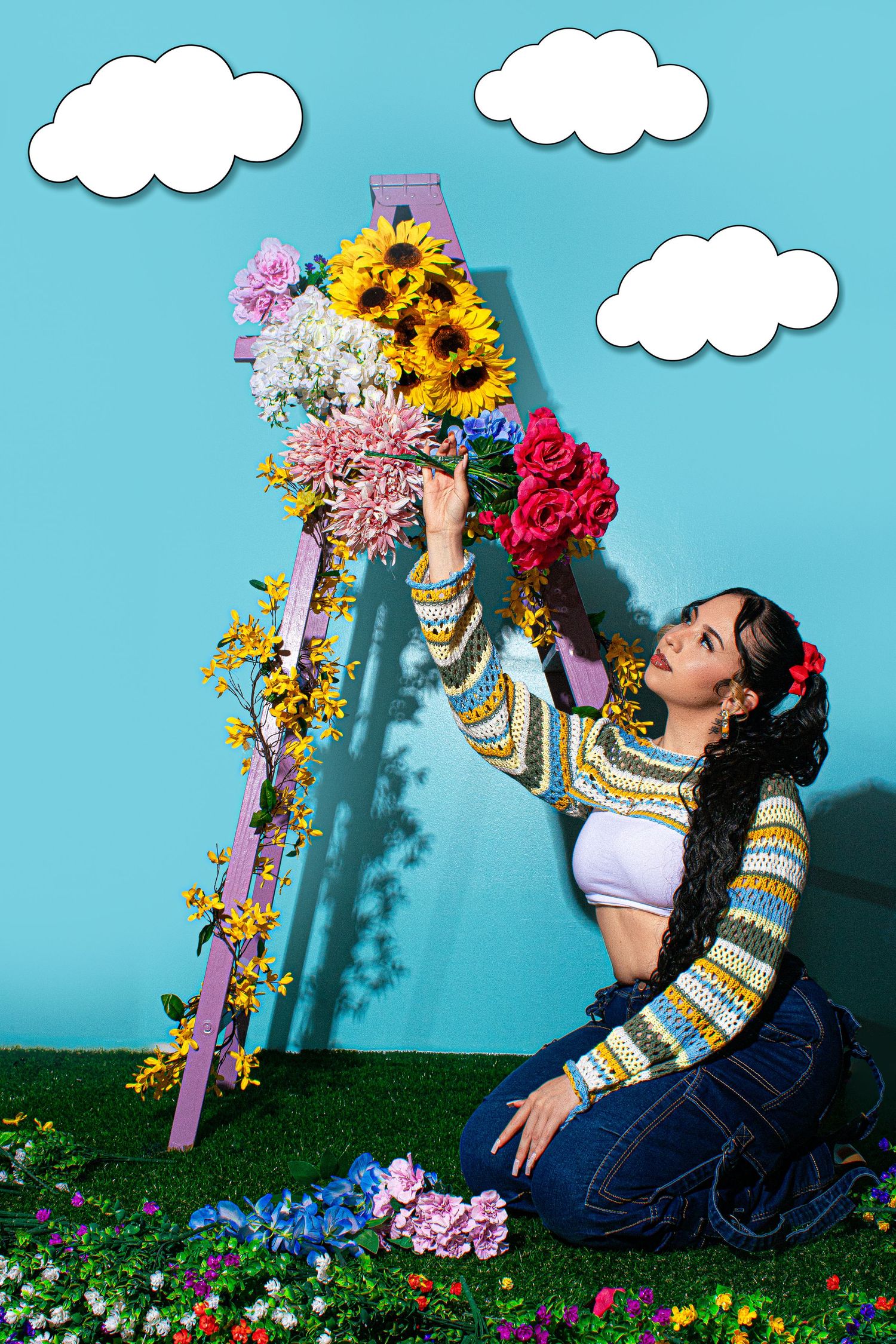 Artistic photo series with flowers and painted clouds against blue backdrop.
