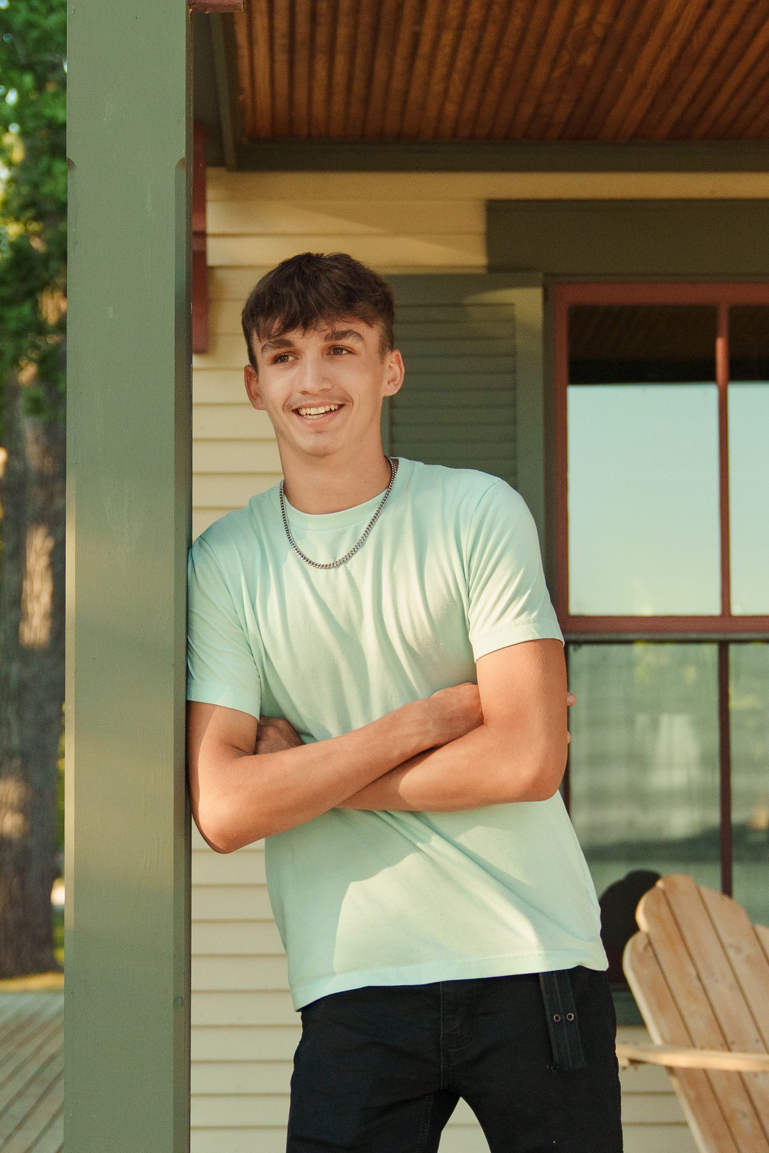 Candid outdoor portraits showing joyful expressions on a front porch.