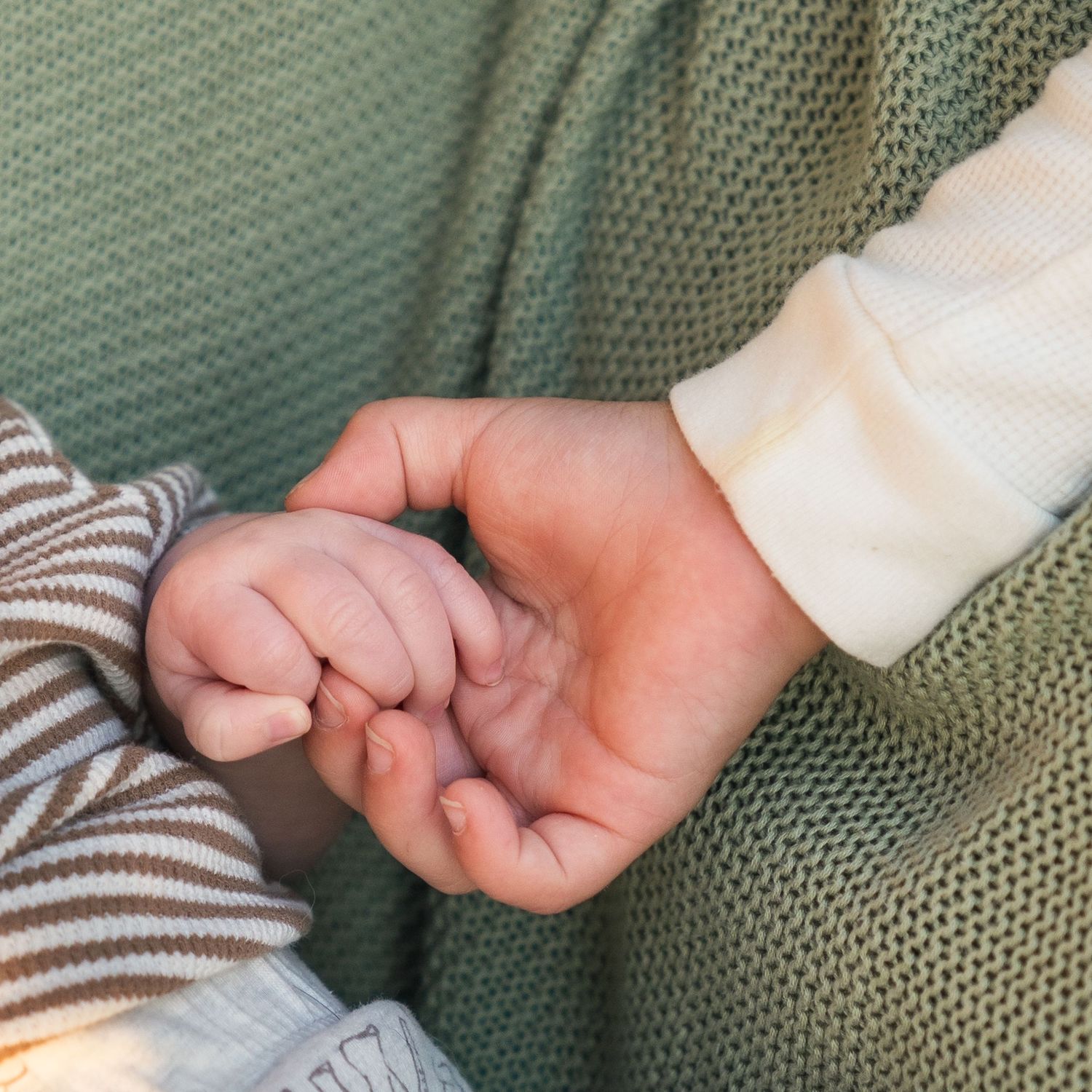 A series of hands holding one another in six sequential photos on a green textured background.
