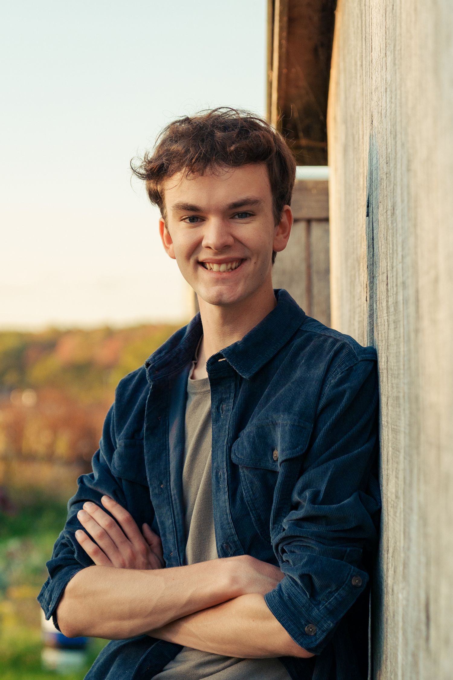 A series of four photos showing someone in a blue denim jacket leaning against white pillars outdoors.