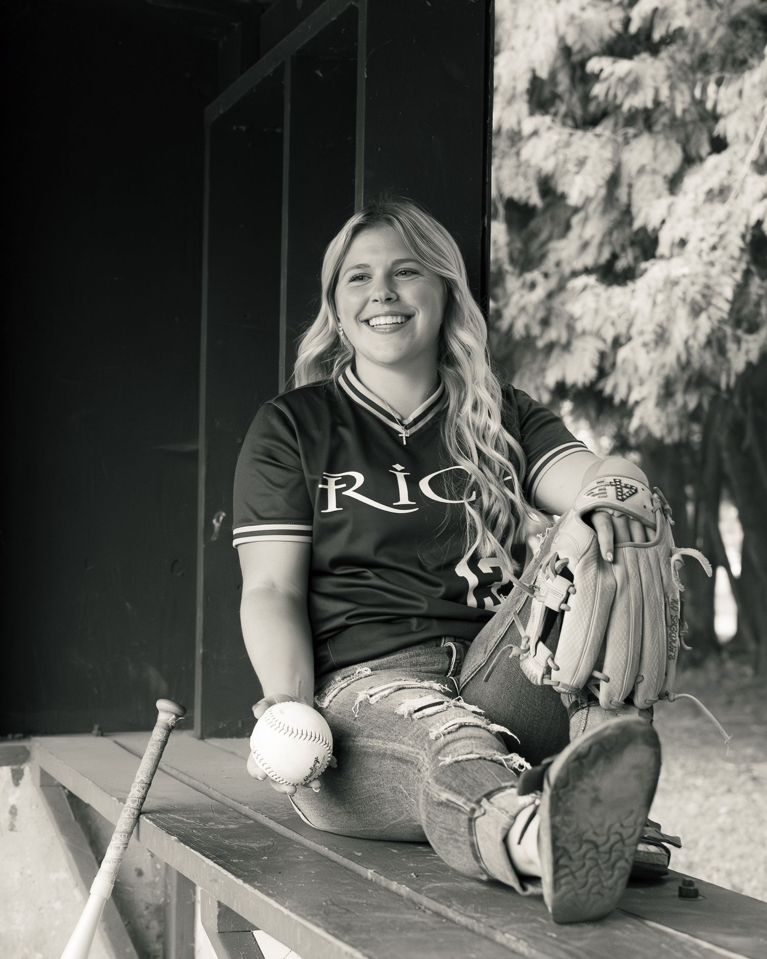 Black and white photo series showing a softball player seated in dugout relaxing with glove and gear between plays.