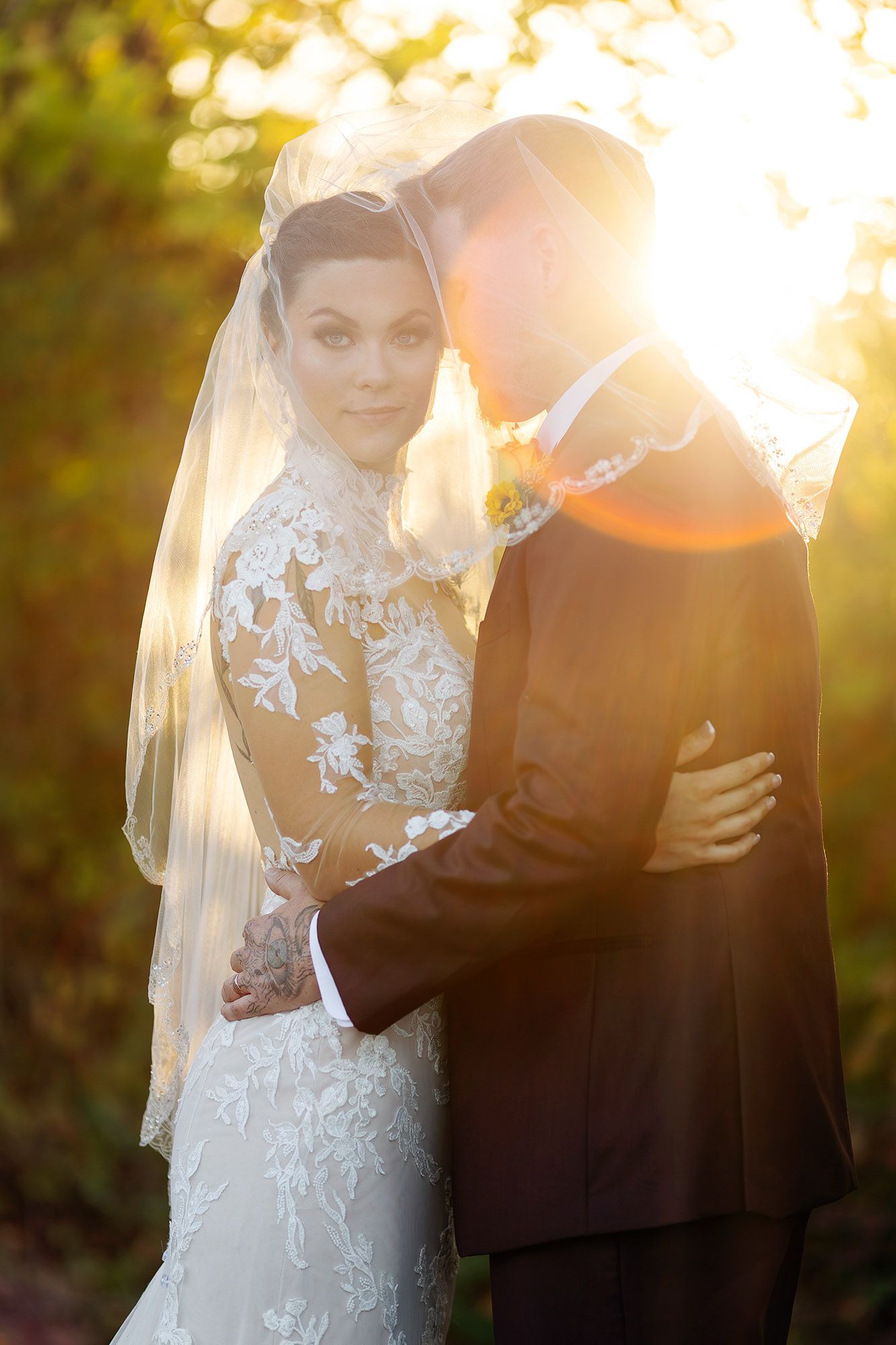 Bride and groom in sunset with sun flare, wedding photographer in Albany NY.