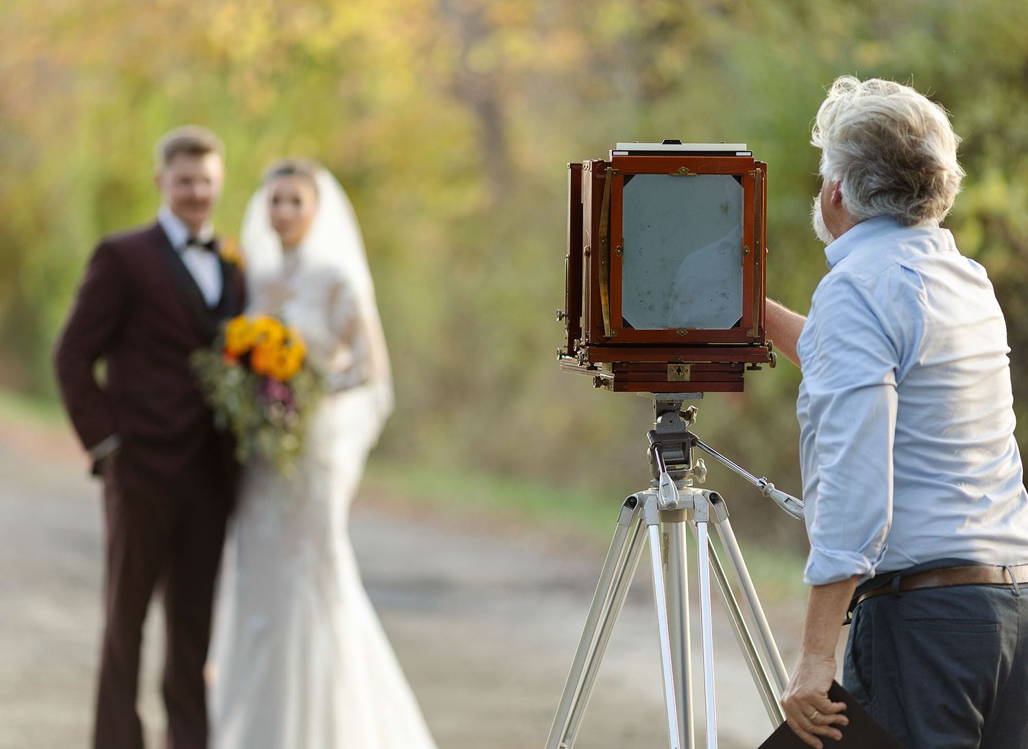 Photographer John Nolan creating gift for bride and groom with vintage large format field camera. Sawicki Studios, Albany NY wedding
