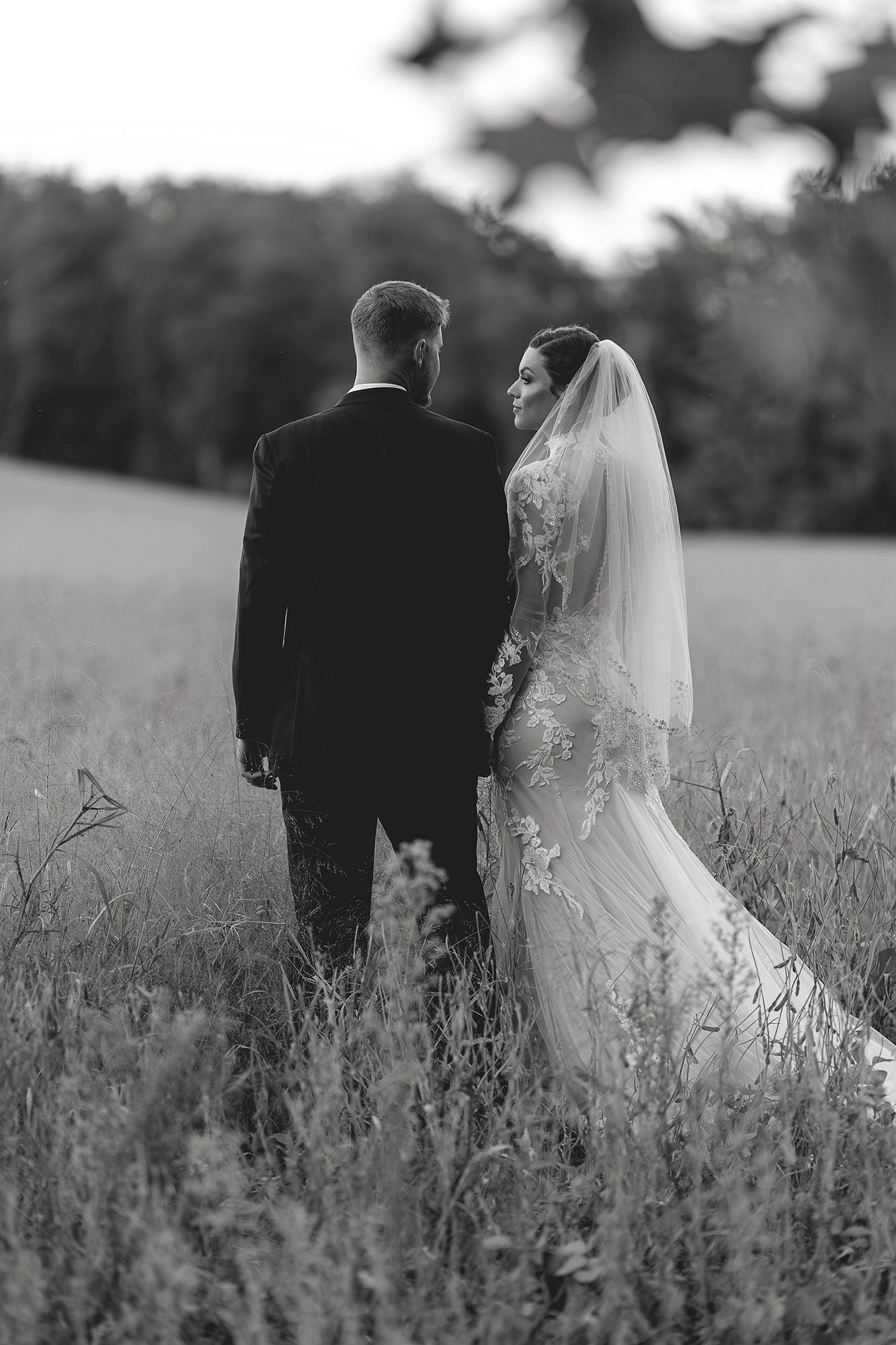 Bride and groom in field, black and white photo. Wedding photography in Albany NY