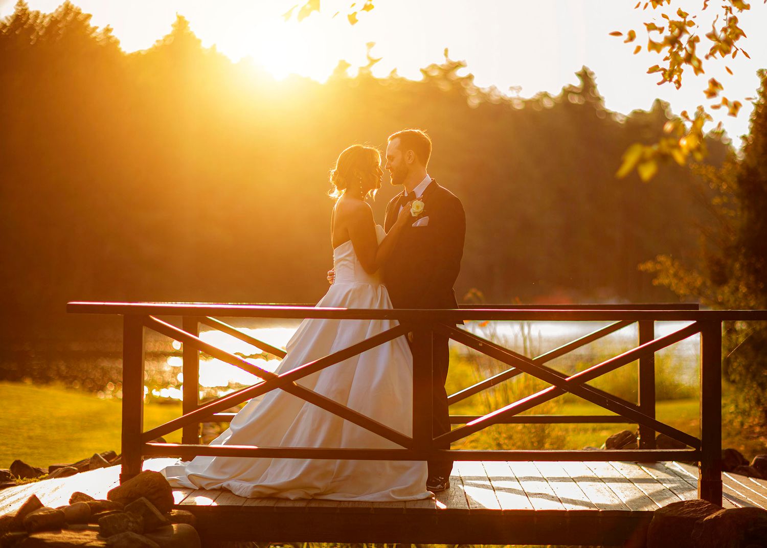 Sunset golden hour couple on bridge on lake at Old Daley Crooked Lake House