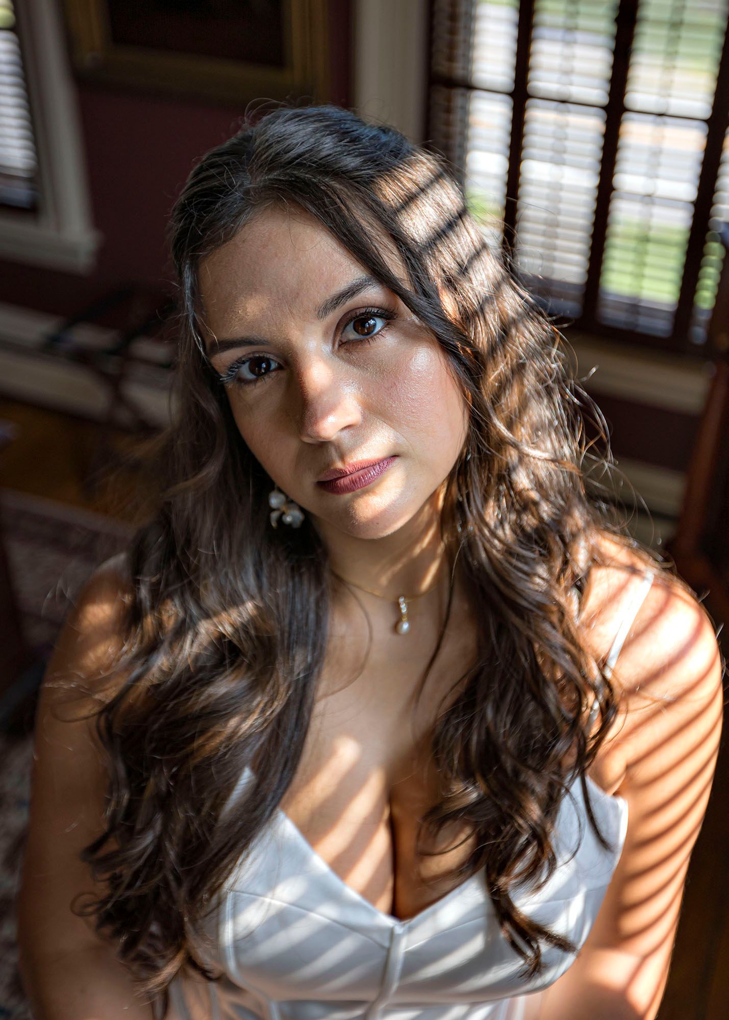 The Mansion of Saratoga wedding, bride in window light