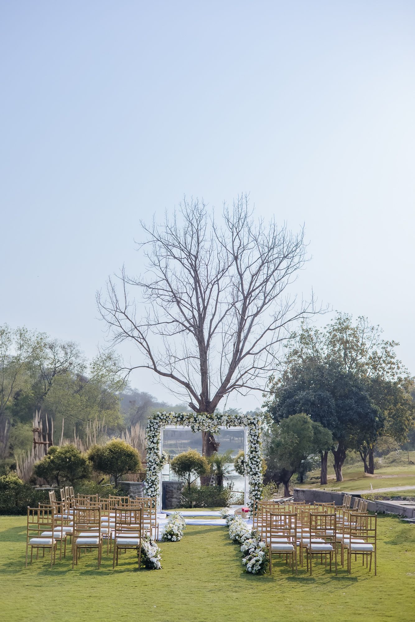 Minimal white floral mandap at Forest Hill for an intimate Indo-Norwegian wedding in Forest Hill, Chandigarh