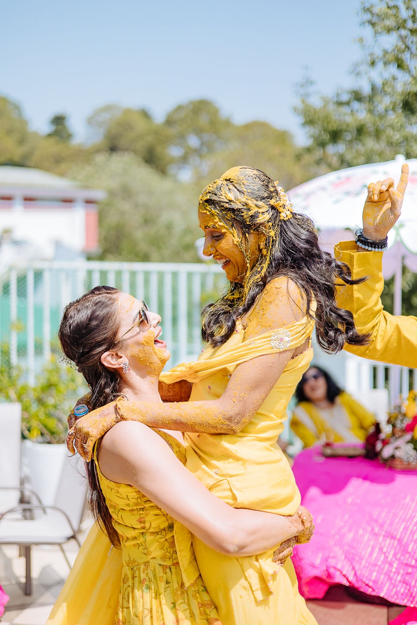 Colorful and candid Haldi moments captured by Fine-art and candid Indian wedding photography and films team Beginnings For You.