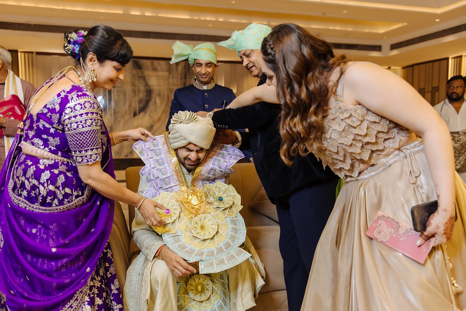 Shorye receiving blessings from his family before the Indian wedding at Tivoli Chattarpur