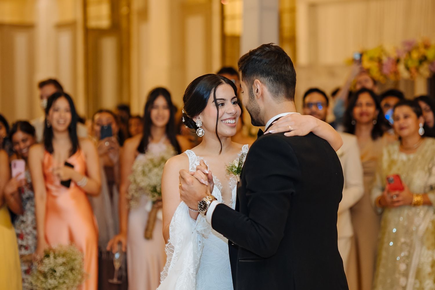 Newlyweds Shorye and Leah enjoying their first dance surrounded by loved ones, after the christian wedding ceremony at Tivoli Chattarpur