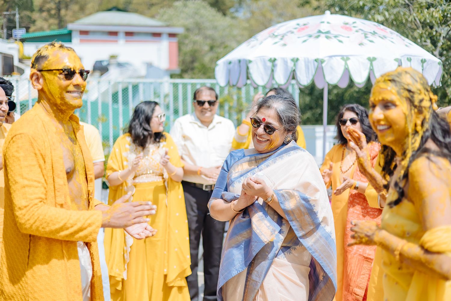 Colorful and candid Haldi moments captured by Fine-art and candid Indian wedding photography and films team Beginnings For You.