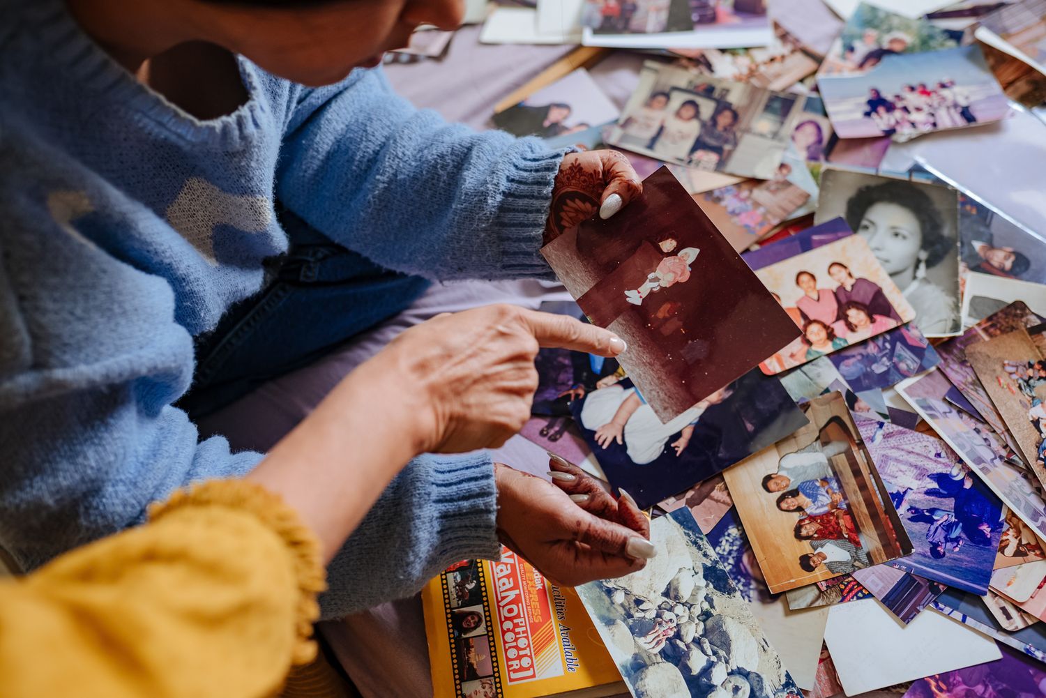 Emotional storytelling wedding photograph of a bride with treasured family memories by Luxury candid wedding photography capturing nostalgia