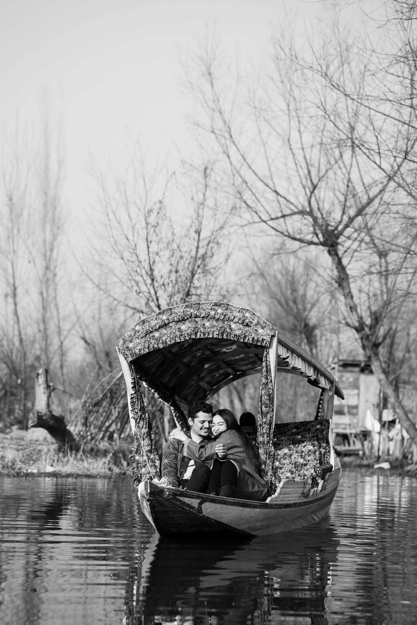 Natural fine-art pre-wedding photography in a Shikara at The Dal Lake with picturesque Kashmir valleys