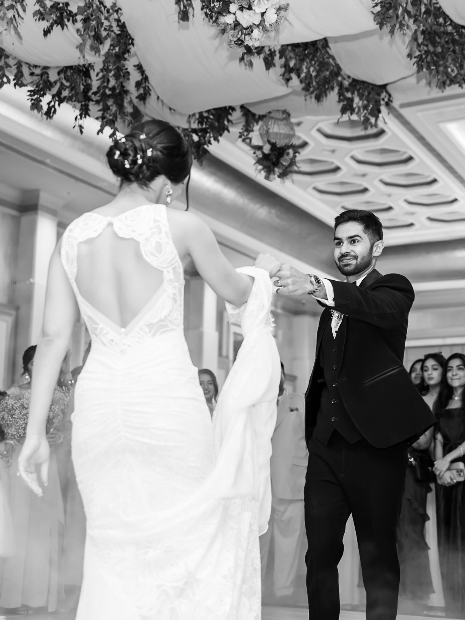 Newlyweds Shorye and Leah enjoying their first dance surrounded by loved ones, after the christian wedding ceremony at Tivoli Chattarpur