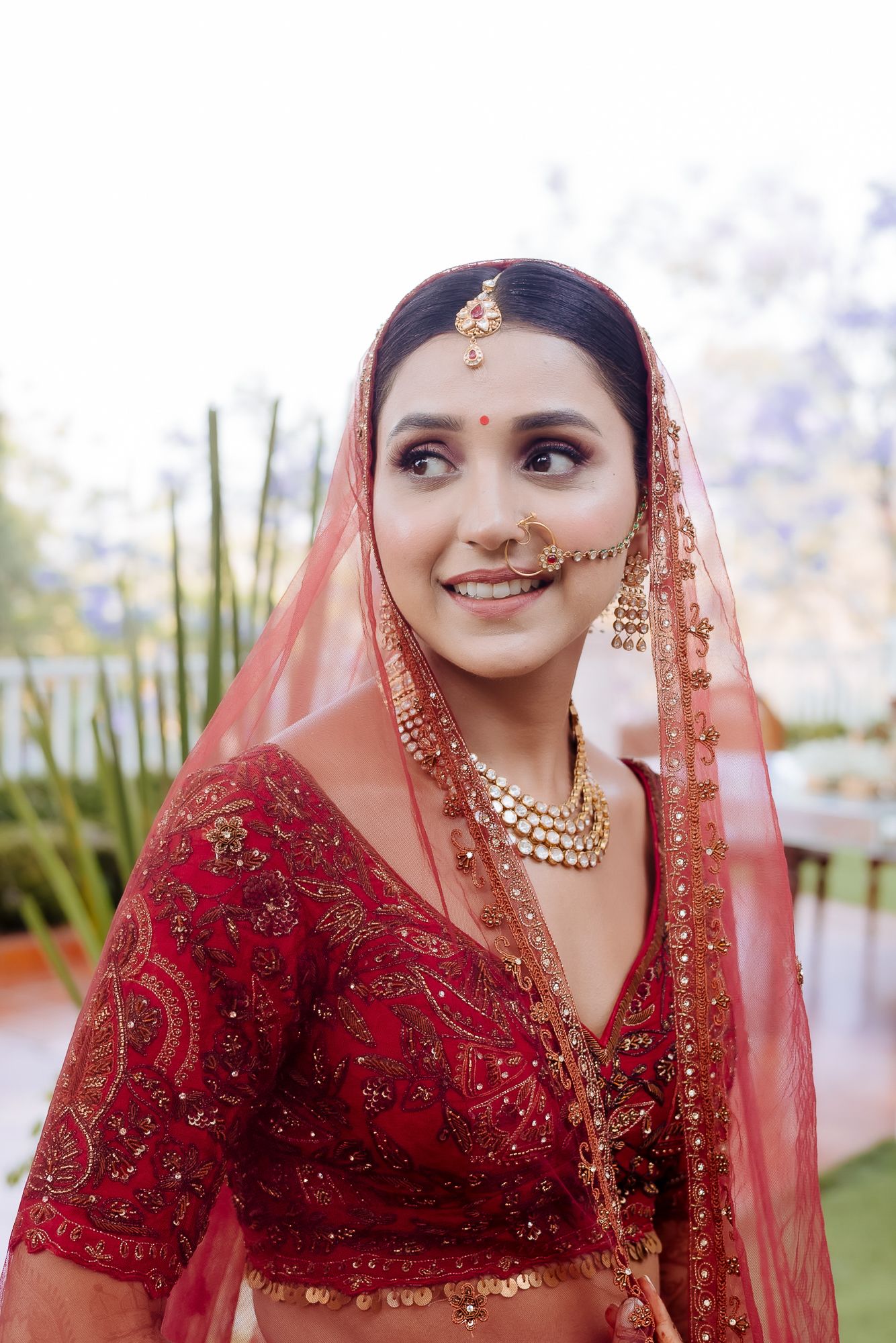 Indian bride in maroon lehenga with fine-art portraits for an intimate wedding of 30 people wedding in the hills at Daleside Manor, Kasauli
