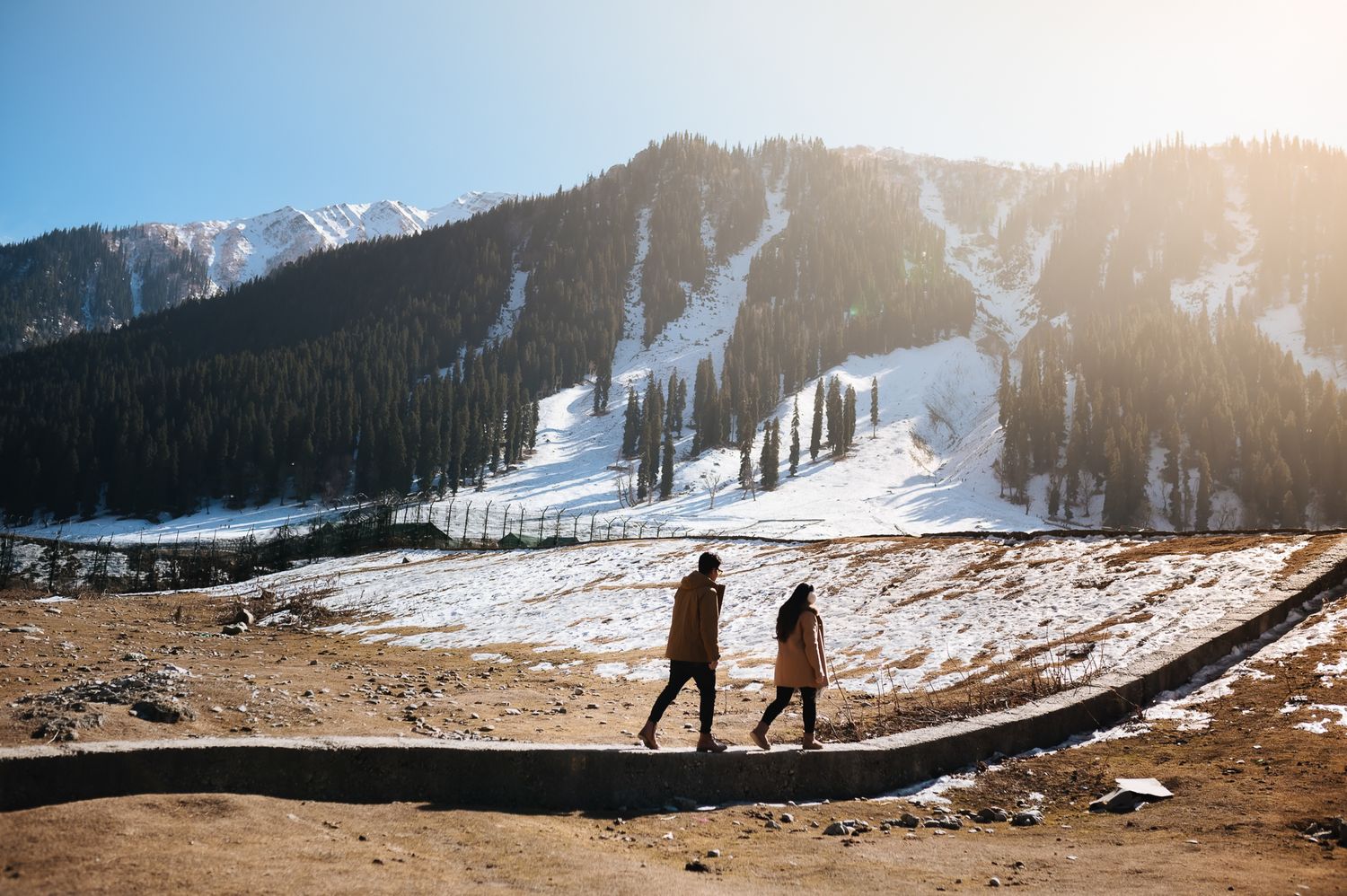 Pre-wedding couple walking hand in hand in Srinagar, nostalgic editorial style in Gulmarg Valley