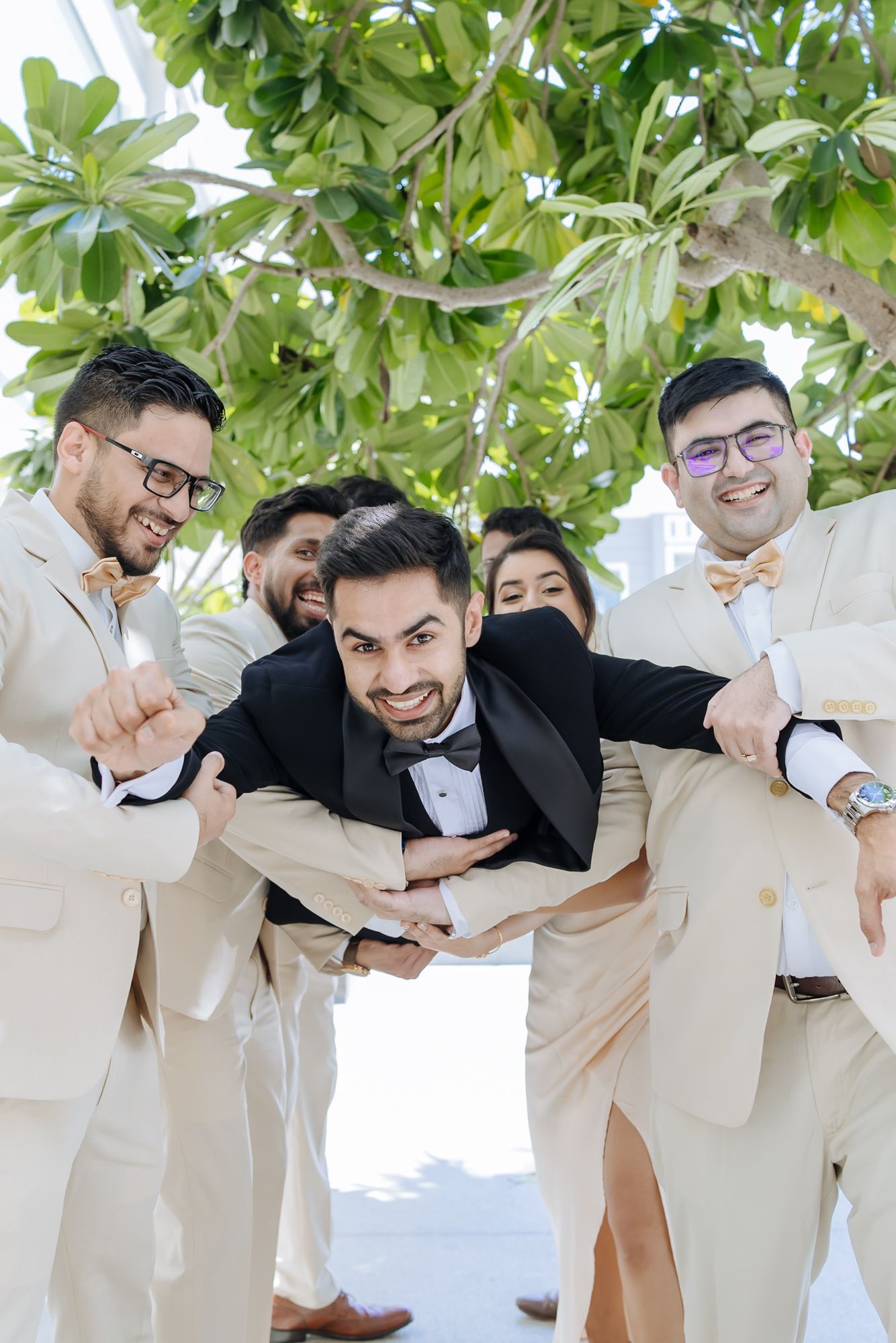 Groomsmen reacting as Shorye gets ready for his wedding at Tivoli Chattarpur.