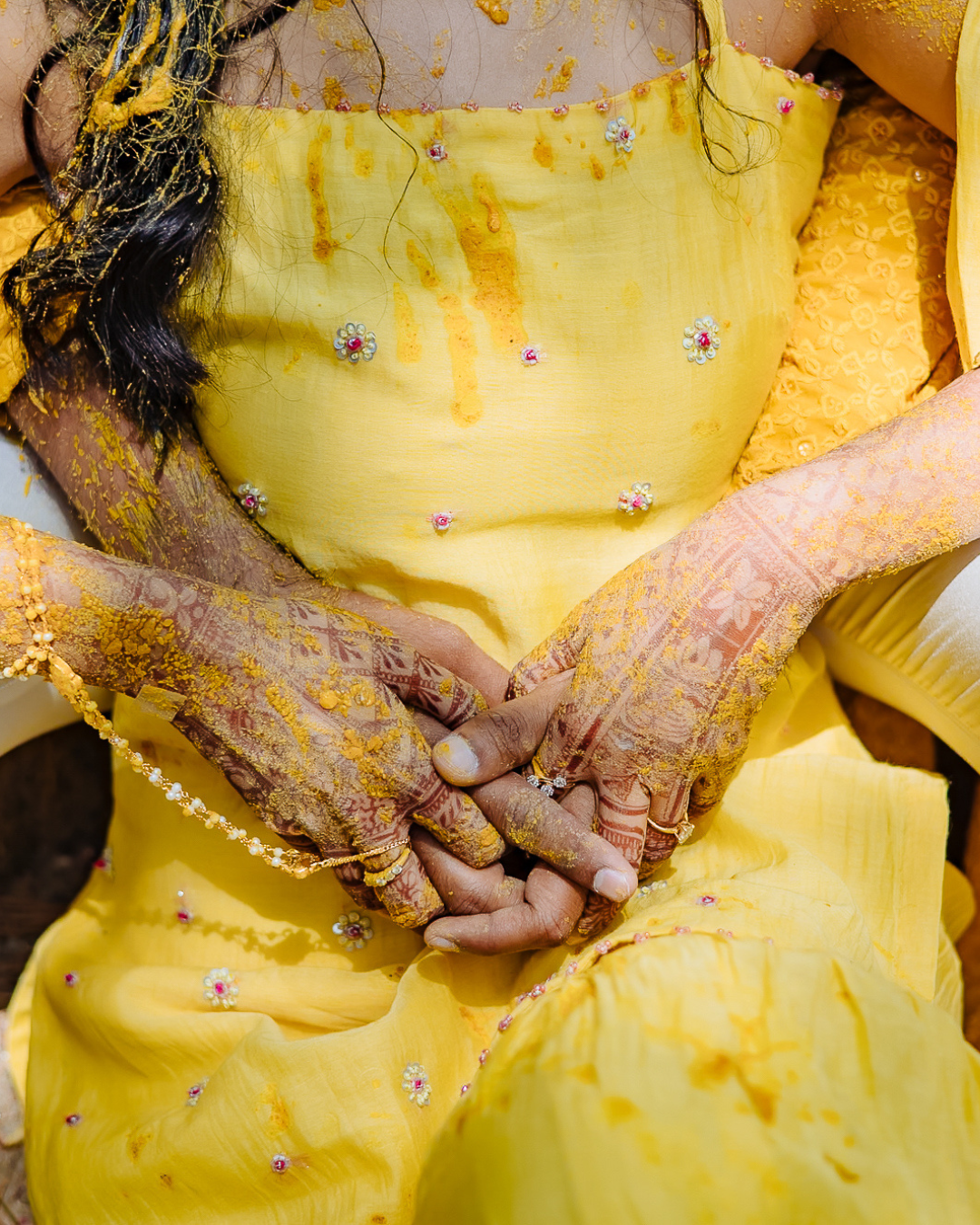 Colorful and candid Haldi couple portraits captured by Fine-art and candid Indian wedding photography and films team Beginnings For You.