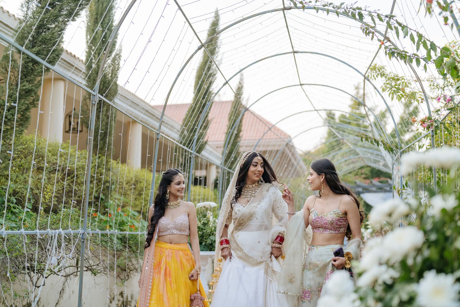Family celebrating the groom's arrival with music and dancing for an Indo-Norwegian fusion wedding in Forest Hill Chandigarh