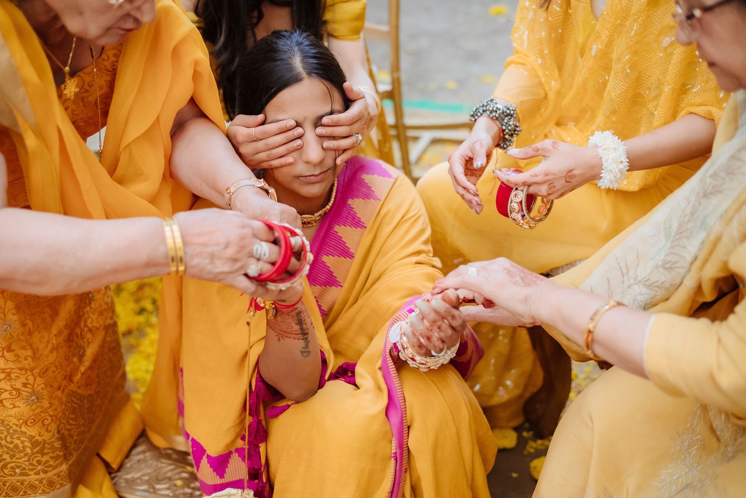 Traditional Punjabi Chooda ceremony captured in a candid storytelling style during an indo-norwegian wedding in Chandigarh