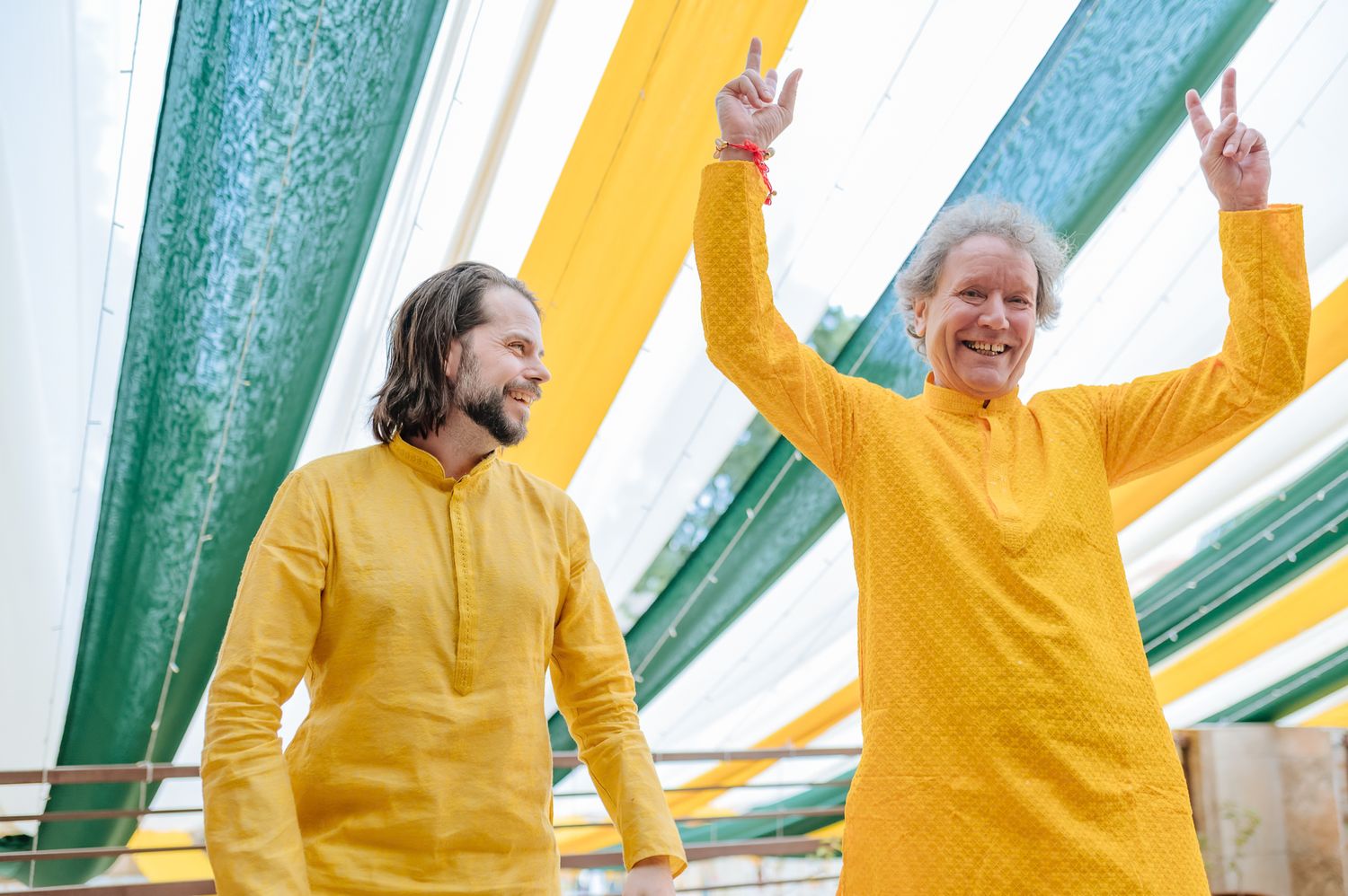 Kids covered in turmeric during an Indo-Norwegian wedding and playing with flowers during a joyful Haldi wedding ritual