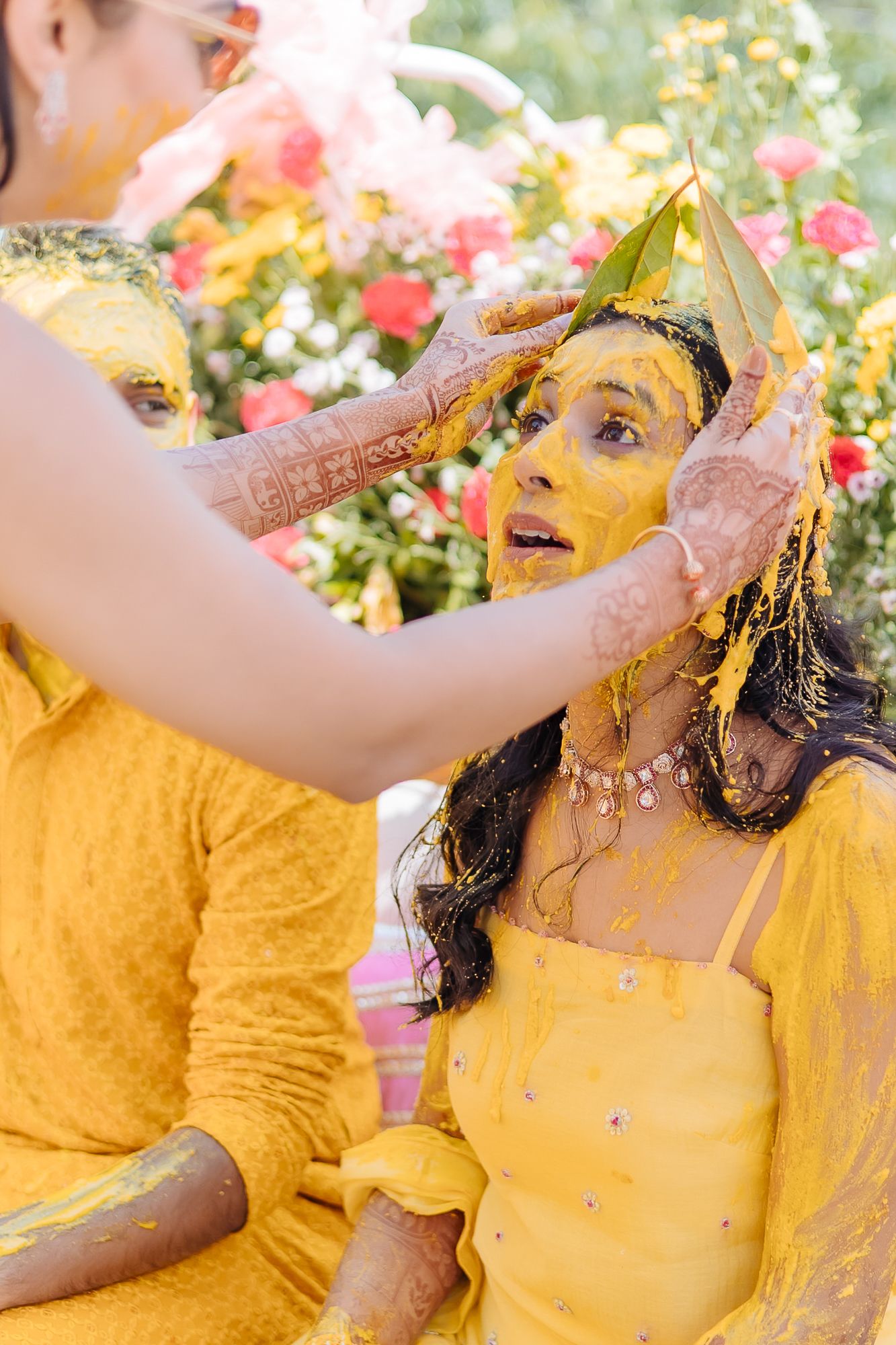 Colorful and candid Haldi moments captured by Fine-art and candid Indian wedding photography and films team Beginnings For You.