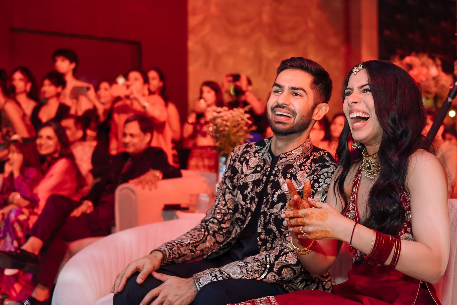 Shorye and Leah reacting to a family dance performance at Tivoli Chattarpur