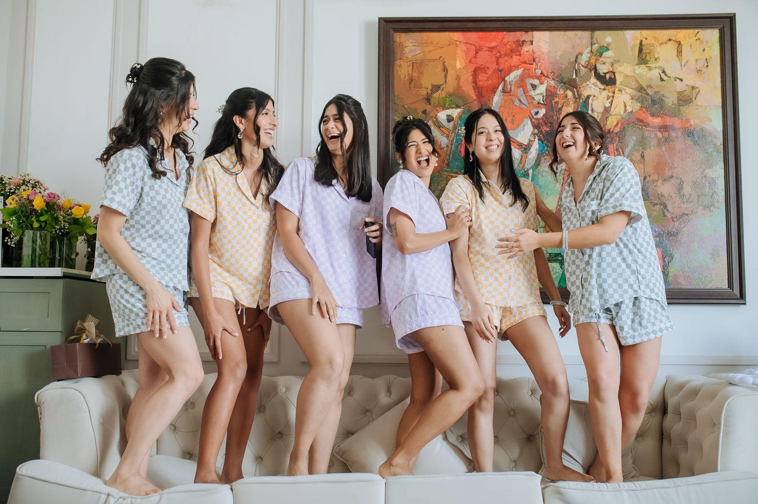 Bridesmaids celebrating with Leah during her wedding morning at Tivoli Chattarpur.