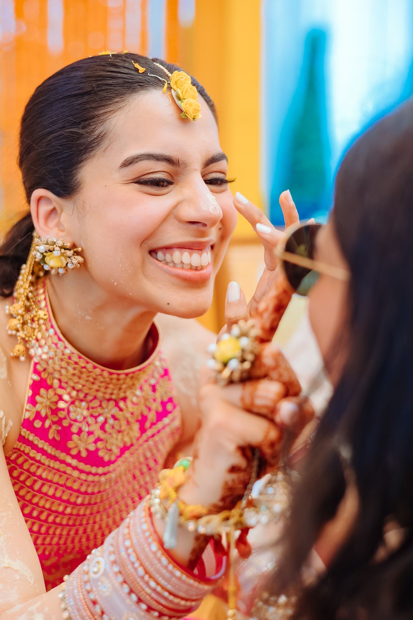 Wedding guests applying haldi and blessing Shorye and Leah at Tivoli Chattarpur