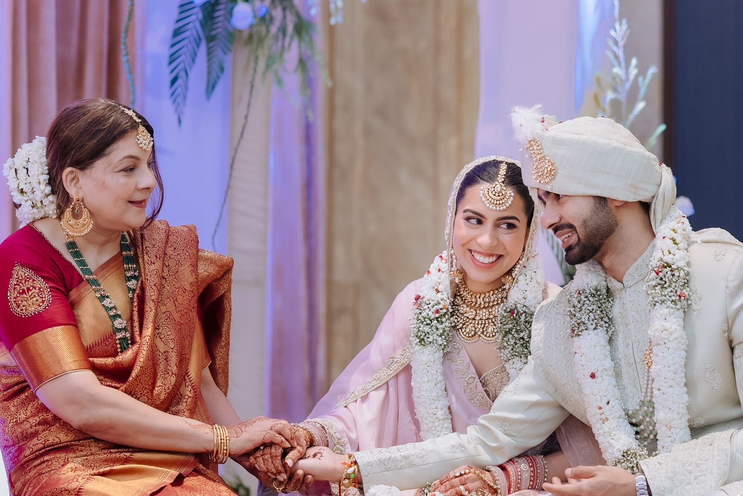 Shorye and Leah performing their wedding pheras indoors at Tivoli Chattarpur