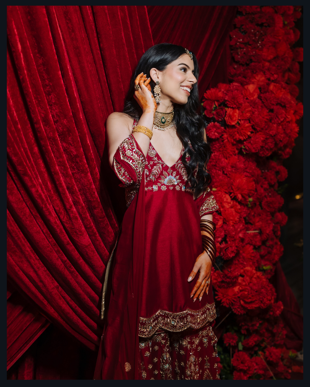 Shorye and Leah posing together at their glamorous Sangeet celebration at Tivoli Chattarpur