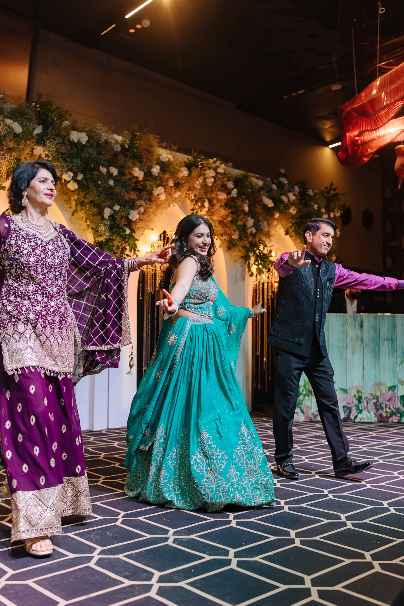 Family members dancing during Shorye and Leah’s Sangeet at Tivoli Chattarpur