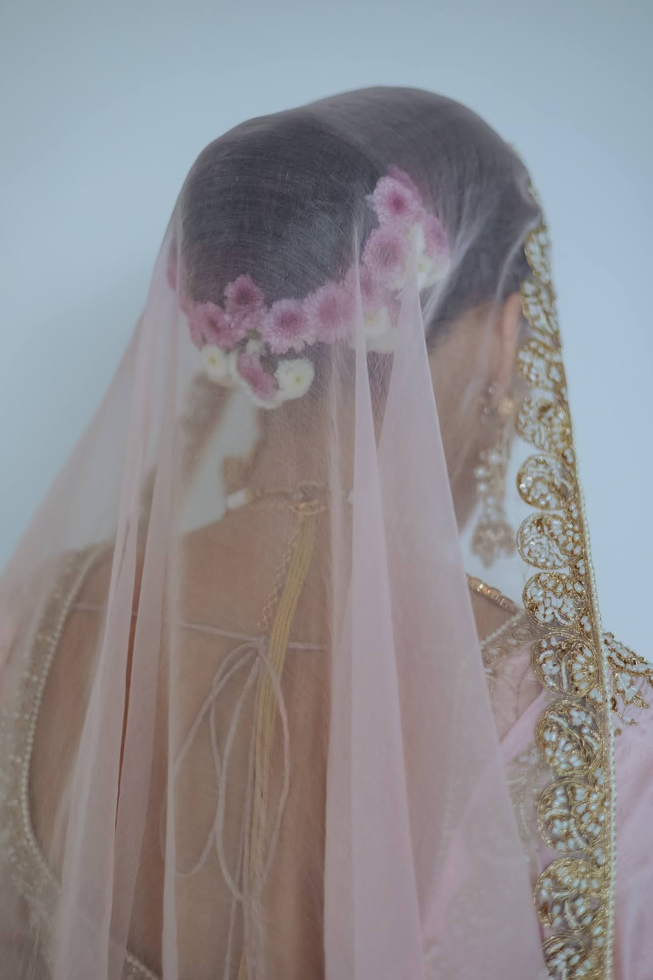 Leah in an elegant pastel pink bridal look at her Indian wedding at Tivoli Chattarpur
