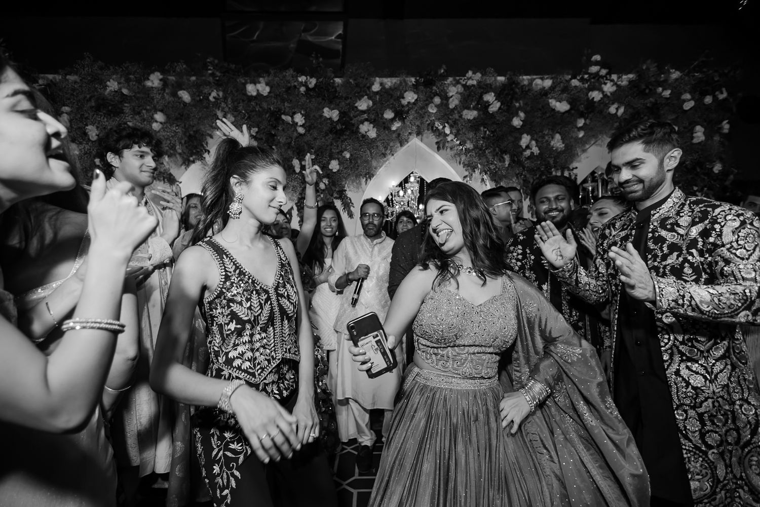 Bride and groom leading an unforgettable dance battle at their wedding celebration at Tivoli Chattarpur