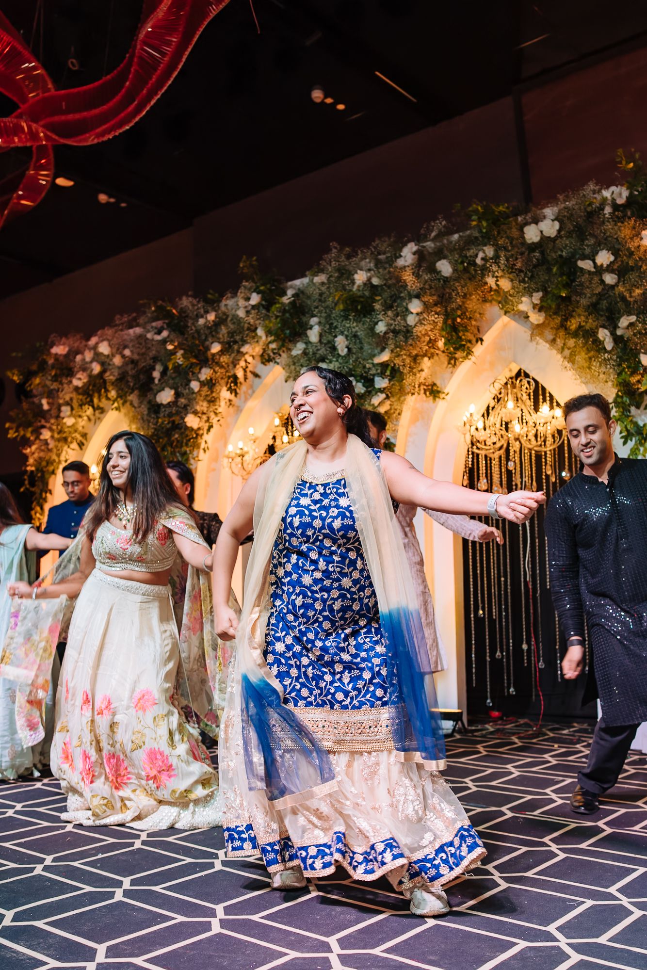 Friends celebrating Shorye and Leah with a lively Sangeet performance at Tivoli Chattarpur