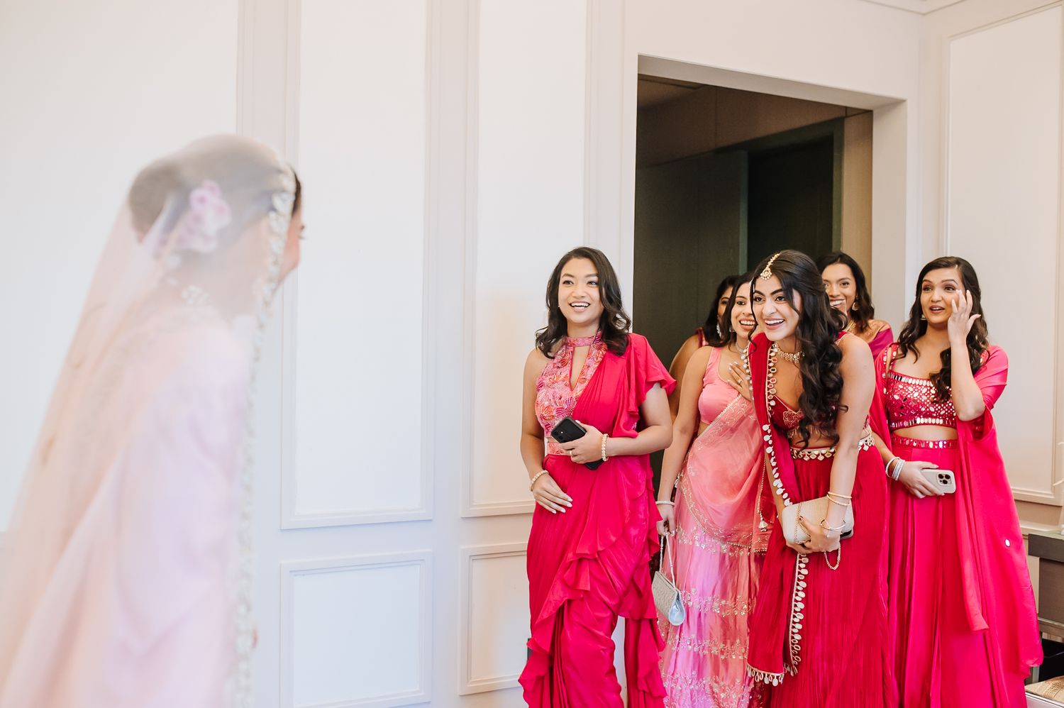 Leah’s radiant bridal portrait with her bridesmaids in shades of pink at Tivoli Chattarpur