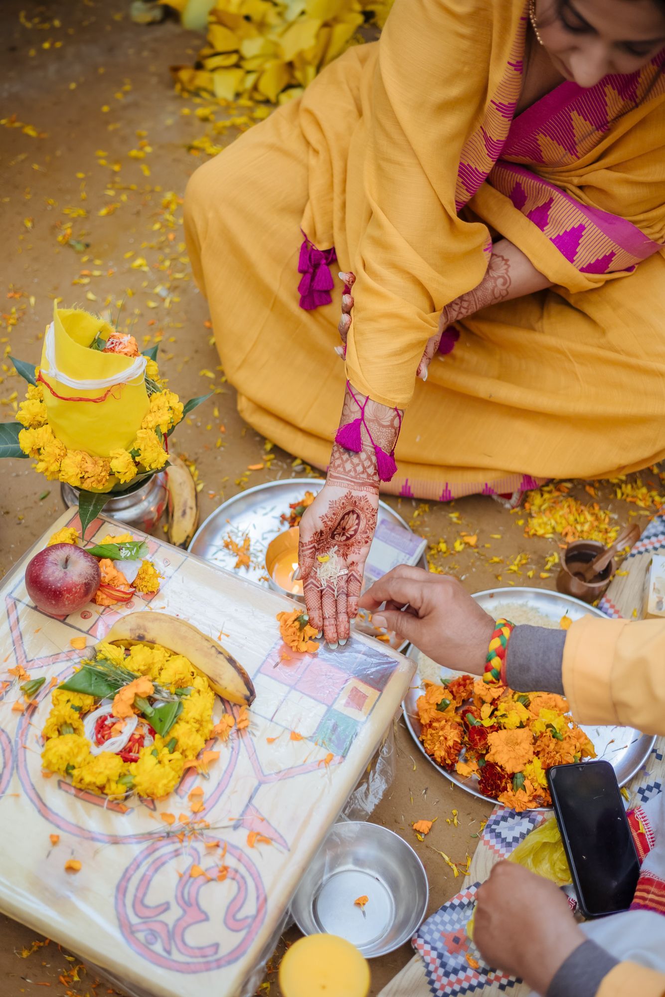 Close-up of traditional ivory and red Chooda bangles on the bride's wrists