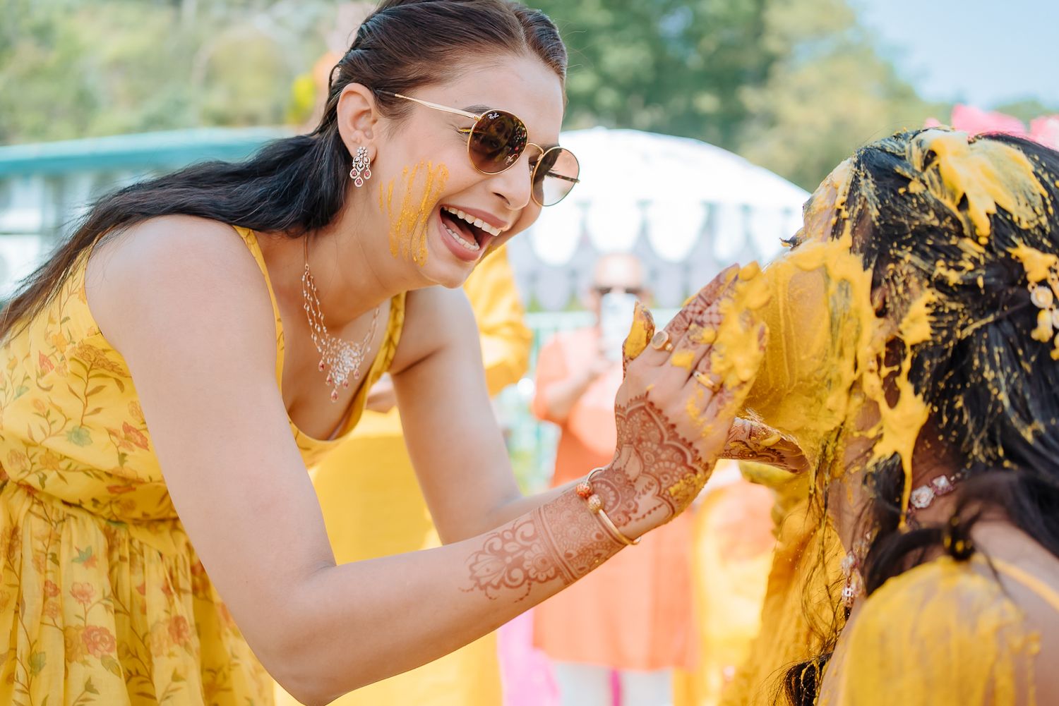 Colorful and candid Haldi moments captured by Fine-art and candid Indian wedding photography and films team Beginnings For You.